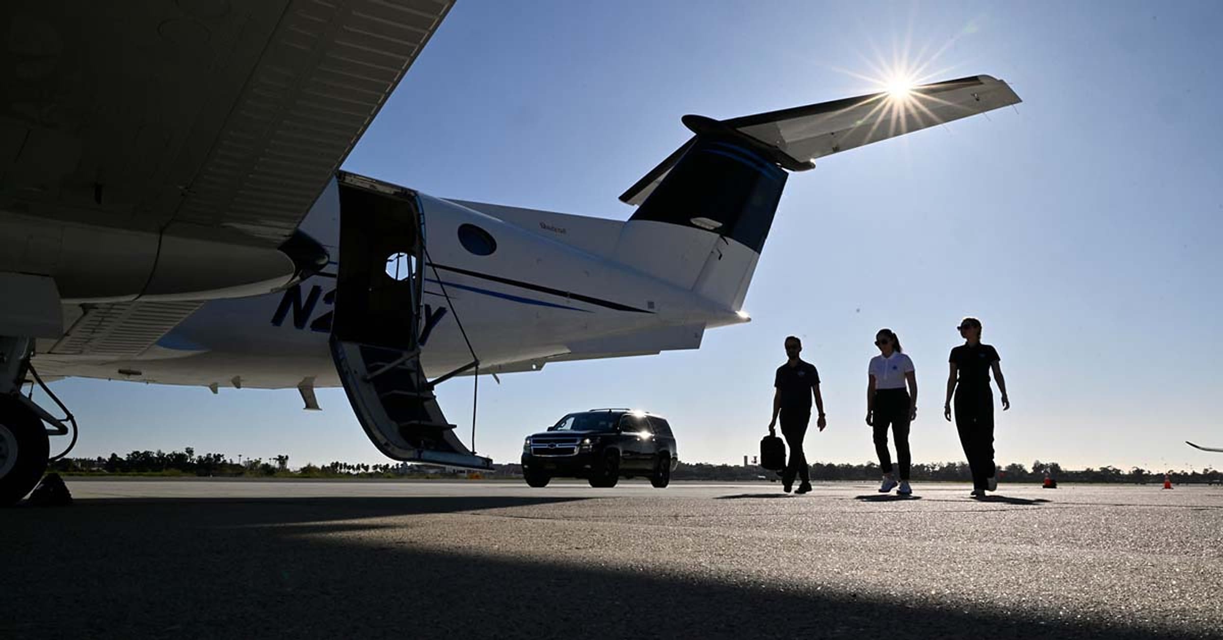 Passengers boarding a Clipper Aviation King Air 350